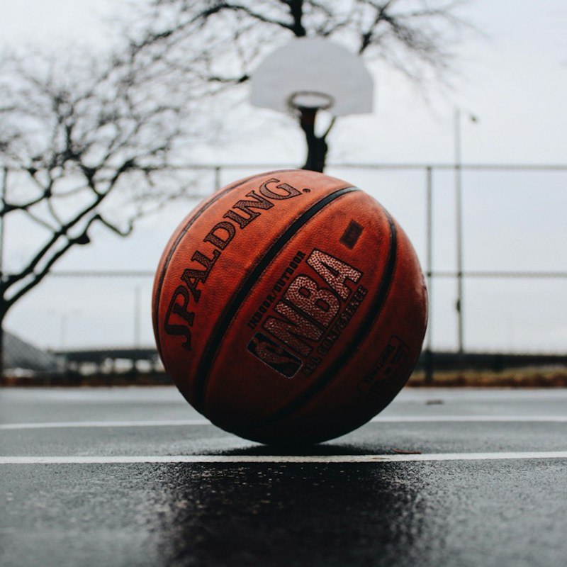 Basketball on court surface.